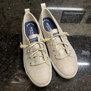 Girls, Sperry, Gold or Platinum sneakers in a size 4